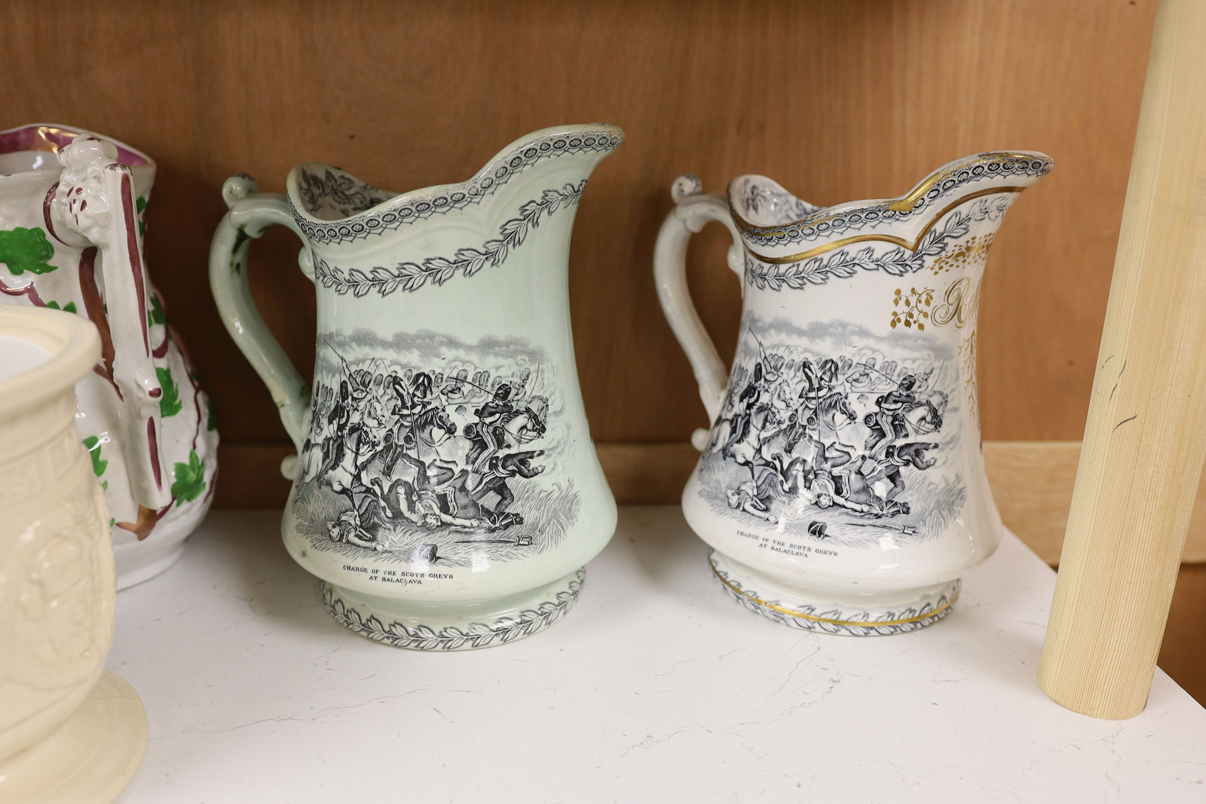 Eight Victorian relief moulded earthenware jugs relating to historic battles and the military